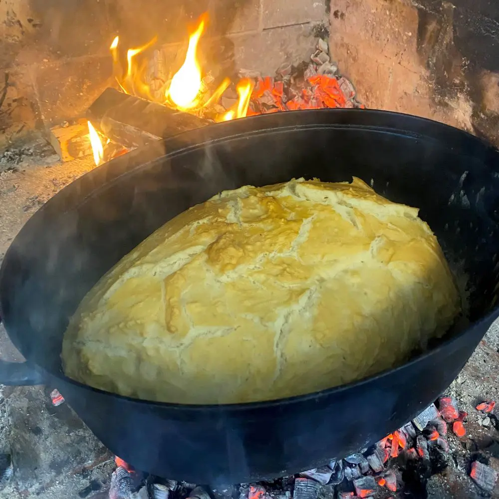 Bread is baked over an open fire.