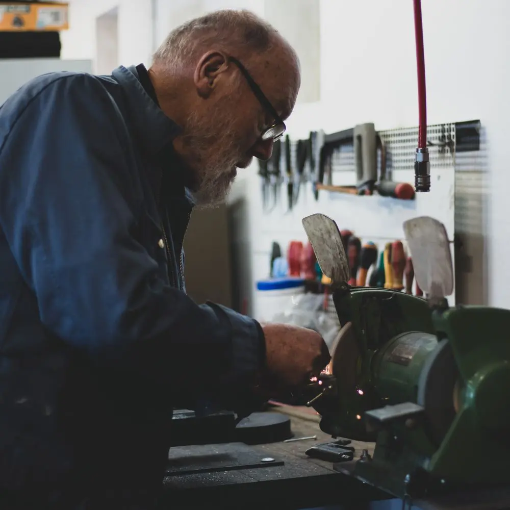 A man works at the tractor workshop.