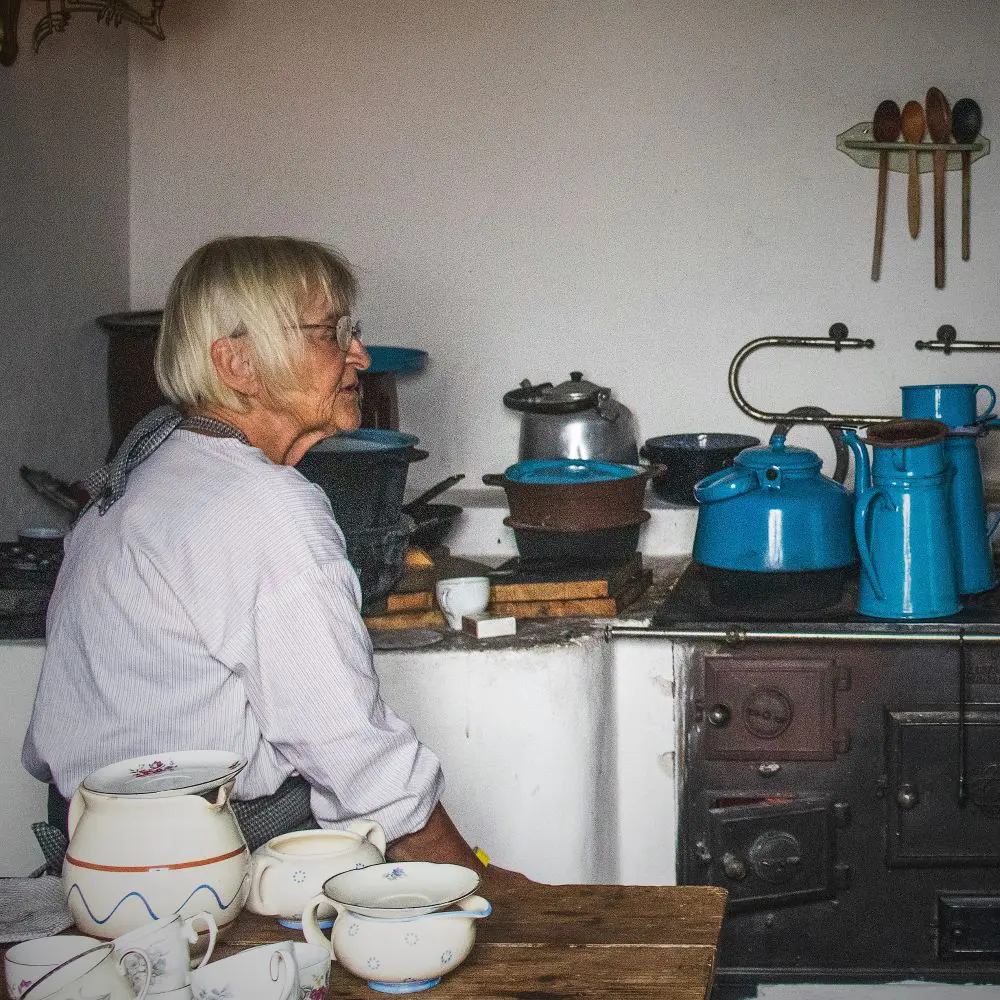 A volunteer from the Polish house group sits in the Polish house.