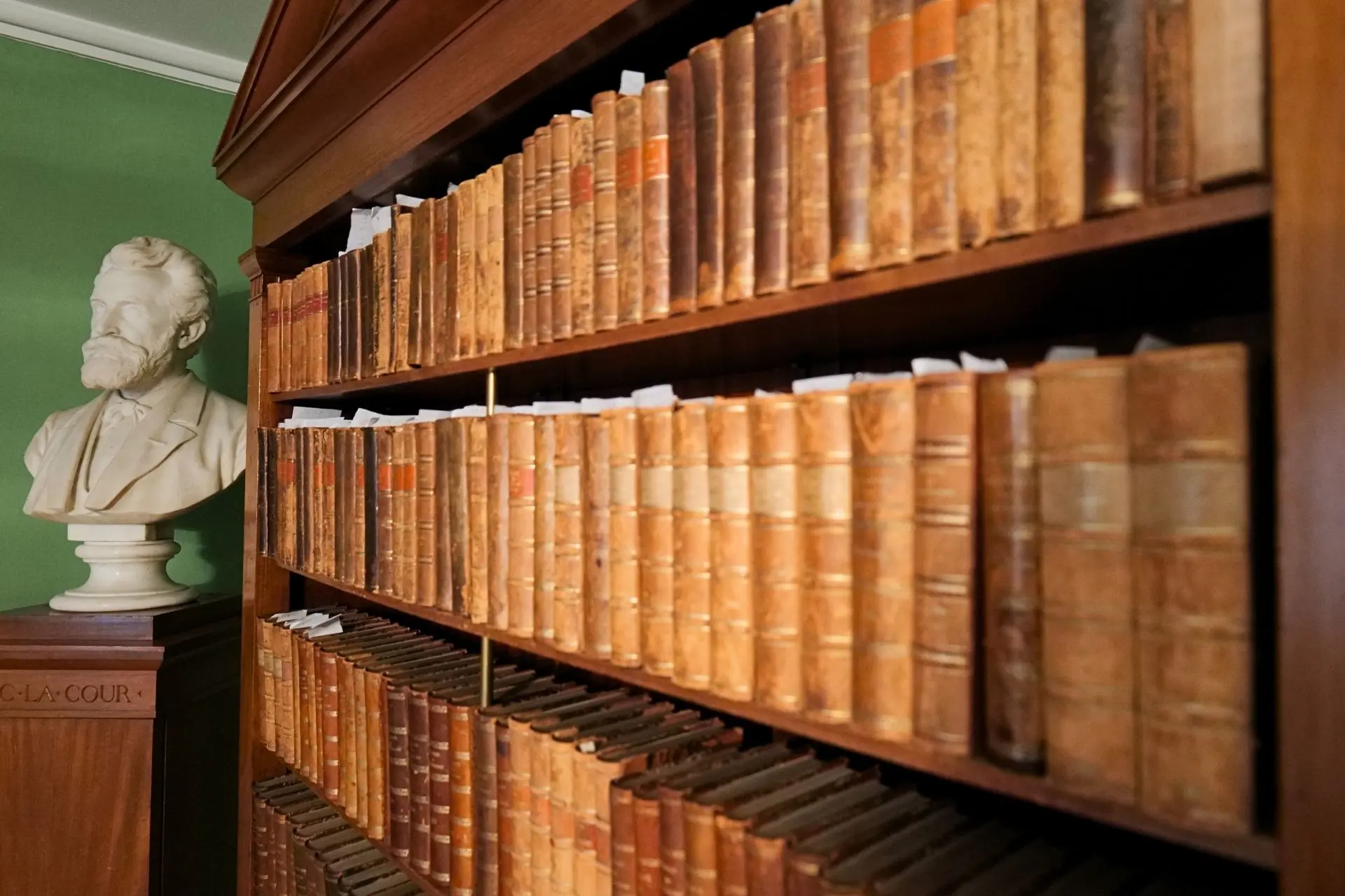 Shelves filled with Journal of Agricultural Economics from the Royal Danish Agricultural Society's meeting room at the Green Museum