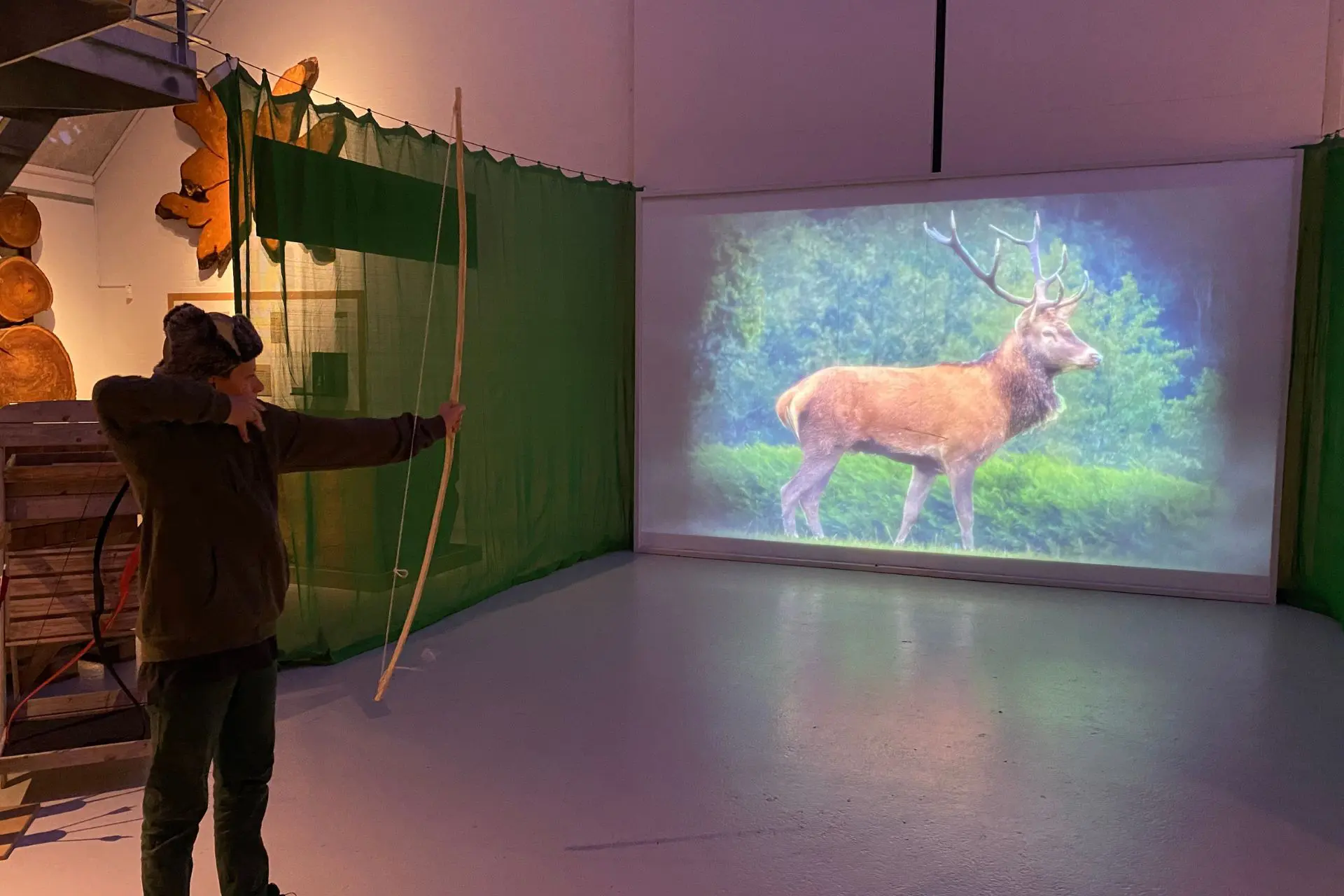 SPOT SHOT Child shoots with a bow at a training course at the Green Museum