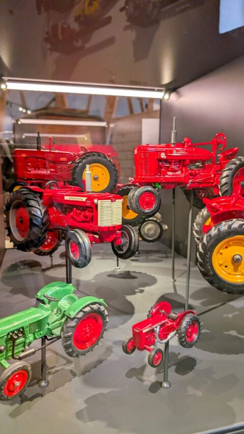 Tractors in a display case